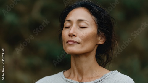 Fototapeta Naklejka Na Ścianę i Meble -  Woman is sitting in a forest
