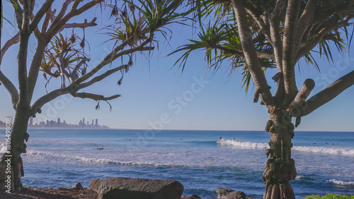 wide angle shot of a surfer riding a wave at burleigh heads