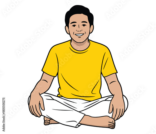 A man sitting cross legged wearing a yellow t shirt smile