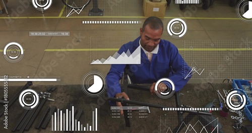 Repairing worker in blue jacket and tie aligning metal bar in workshop, with tools, HUD overlays