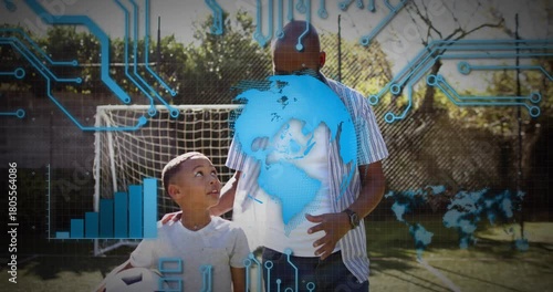 Mature adult placing hand on child's shoulder, guiding soccer while digital globe rotating overhead