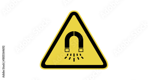 Prominent yellow triangular warning sign featuring a black horseshoe magnet with radiating lines, clearly indicating a strong magnetic field hazard and the importance of safety