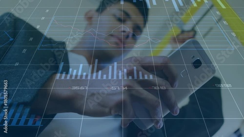 Commuter standing on train, thumb-typing and animating finance charts on phone, checking stocks