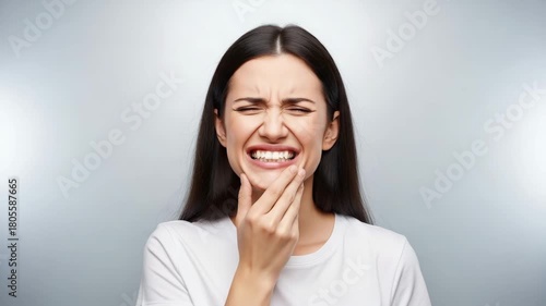 Woman With Frowning Expression Touching Her Chin In Doubt confusion thinking