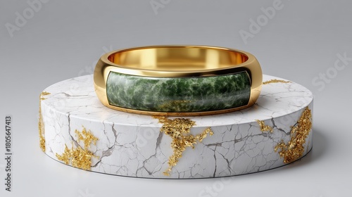 Golden Ring of Elegance: A luxurious golden ring, embellished with a captivating green stone, rests upon a textured, marble-like pedestal, exuding sophistication and timeless beauty.