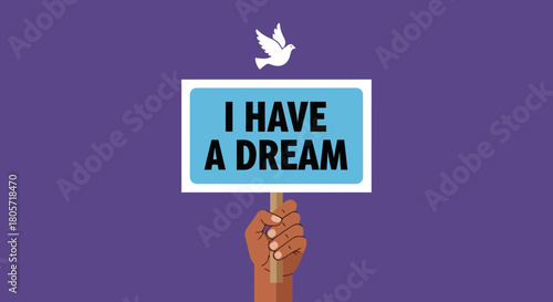 Hand holds I Have A Dream sign with dove above in peaceful demonstration