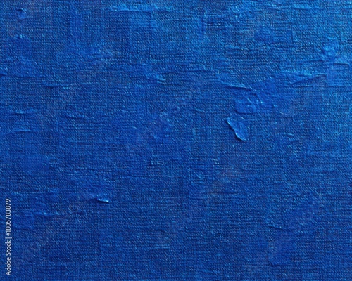 Close-up of a deep blue textured painted canvas with visible brush strokes and fabric weave conveying calm, depth, and a contemplative mood
