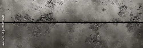 weathered concrete wall with horizontal seam, peeling rough patches and dark stains, moody industrial texture