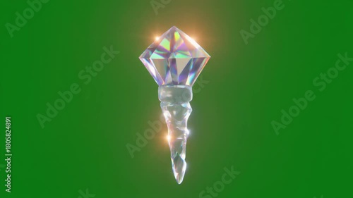 A glowing crystal scepter with a diamond-shaped gem at the top, radiating light against a vibrant green background, symbolizing magic.