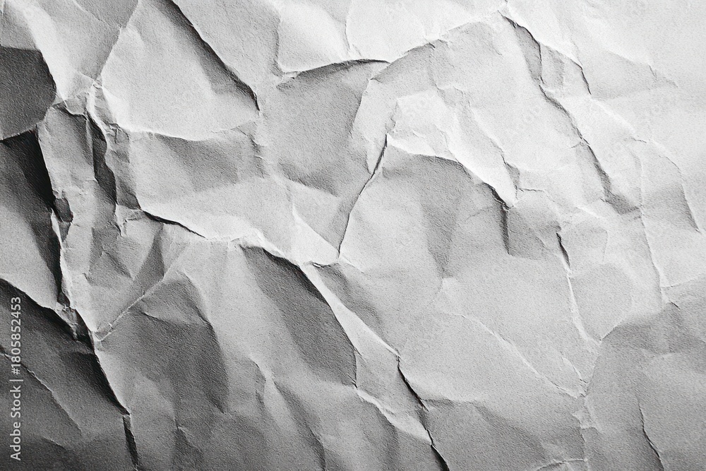 Fototapeta premium Crumpled white paper sheet with deep creases, folds and shadowed texture conveying tension and worn imperfection