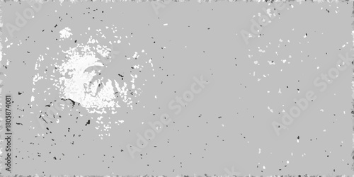 Abstract grayscale textured background with scattered speckles and a central splatter effect