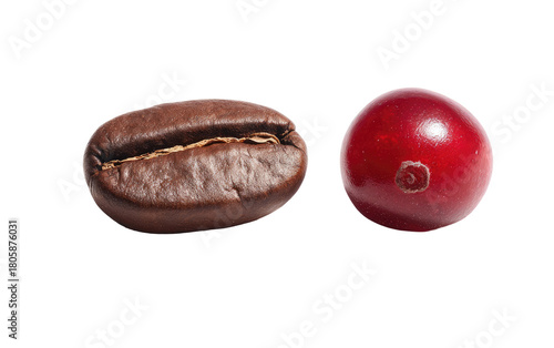 Roasted coffee bean and a red coffee cherry isolated on black