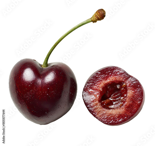 A ripe, dark red cherry, whole and halved, isolated on black