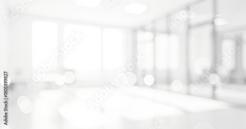 Bright white abstract background with soft focus and circular light effects, creating a calm luminous ambience with gentle glowing highlights and smooth visual depth throughout the scene.