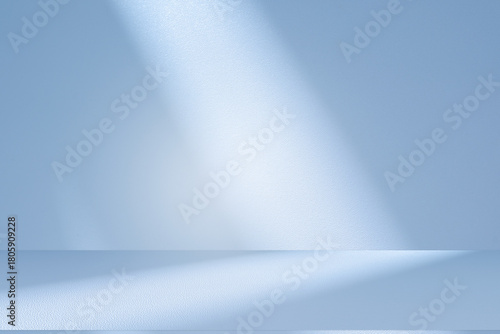 Wall interior background, studio and backdrops show products.with shadow from window color white and blue background for text insertion and presentation product	
