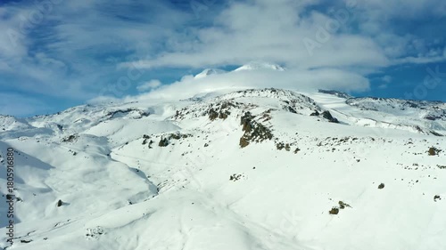Aerial footage captures the breathtaking winter landscape of Mount Elbrus, the highest peak in Europe, located in the North Caucasus region of Russia.