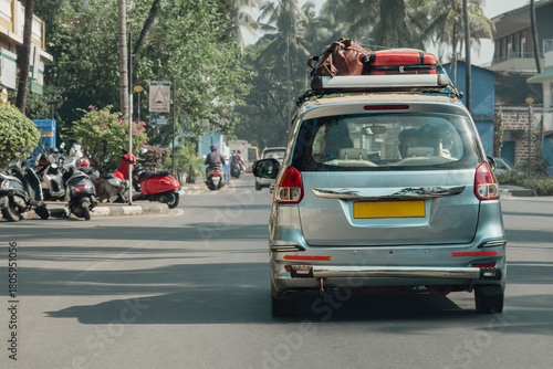 Old vintage suitcases on top of the car, concept of travelling by car, road trip, adventure