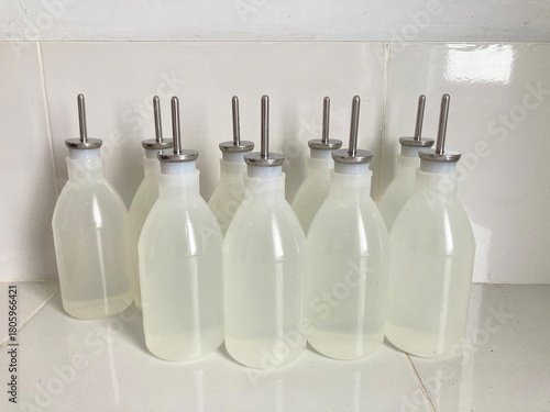 plastic watering bottles with metal spouts