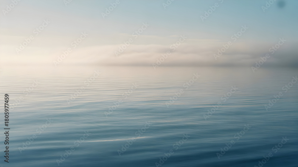 Obraz premium Serene ocean illustration with calm blue water reflecting a soft hazy sky and distant horizon clouds