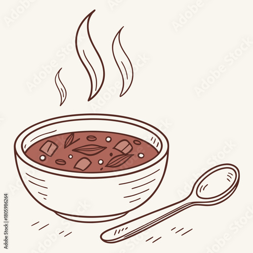 Bowl of hot soup with steam and a spoon