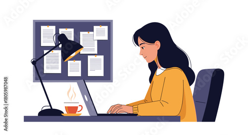 Productive young female professional or student working on her computer at a desk with coffee and a bulletin board.