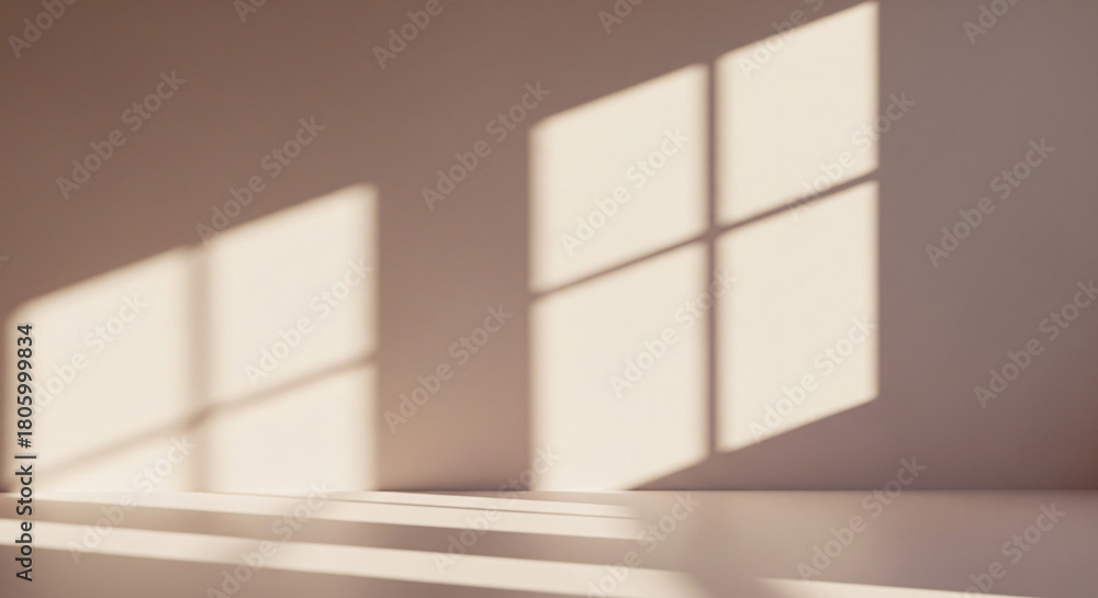 Fototapeta premium empty beige wall background with shadow from the window