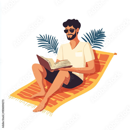 Man reading book on beach towel enjoying summer vacation