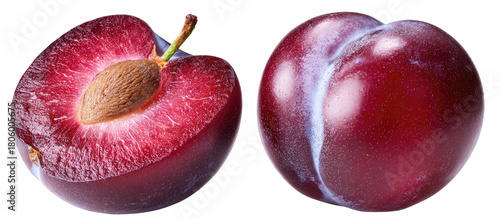 A halved plum reveals its seed, next to a whole plum