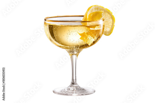 Coupe glass filled with a bubbly, golden cocktail garnished with a lemon twist and slice