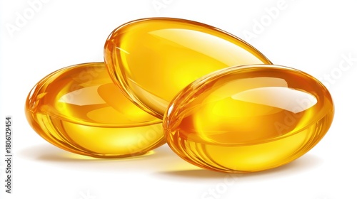 Three transparent golden gel capsules with liquid inside studio shot nutrition