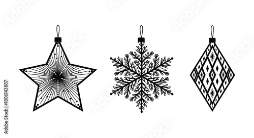 Three intricately detailed black and white christmas ornaments including a star snowflake and diamond shape