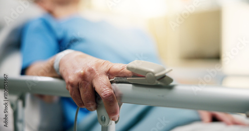Hands, old person and oximeter in hospital bed to monitor pulse, blood pressure and surgery recovery. Closeup, elderly patient and medical machine to track oxygen, chronic condition and critical care