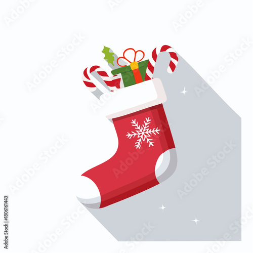 Festive red Christmas stocking overflowing with gifts, candy canes, and a snowflake design, perfect for holiday decorations and seasonal cheer