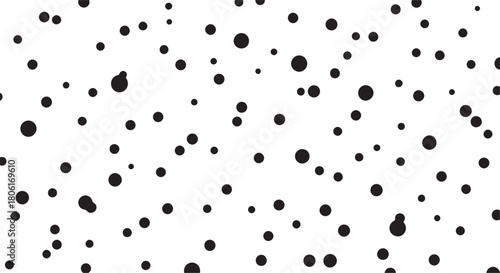 Black Dots of Different Sizes Scattered on White abstract
