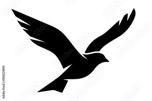 Elegant black silhouette of a bird in flight with wings spread wide against a clean white background