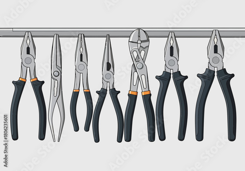 Set of pliers hanging on a metal bar.