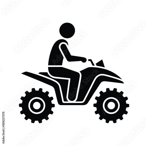 Silhouette of a person riding an all terrain vehicle
