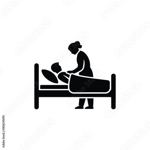 Nurse caring for patient in hospital bed