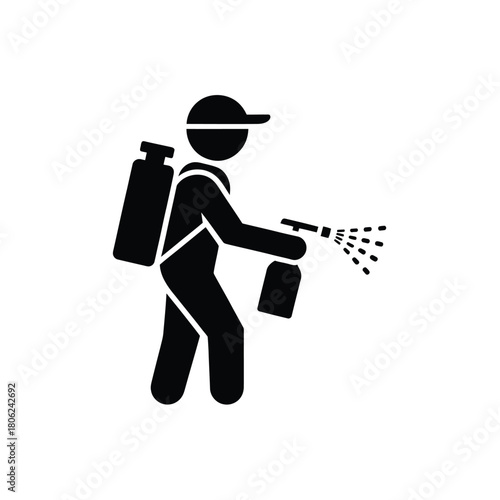 Pest control worker spraying insecticide with backpack sprayer