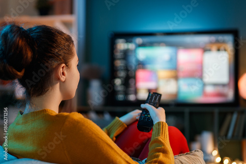 woman watching TV at home