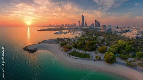 Stunning aerial view of Kuwait City skyline at sunrise with vibrant ocean waves, 4k high quality footage