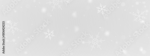 Cold winter night snowfall scene with shimmering snowflakes floating through frosty air, creating a glowing magical atmosphere suited for Christmas, holiday celebration and seasonal design uses