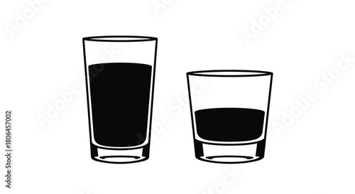 Two glasses one full and one partially filled with dark liquid