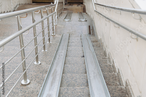 ramp on stairs for baby strollers, bicycles and wheelchairs, accessible urban environment