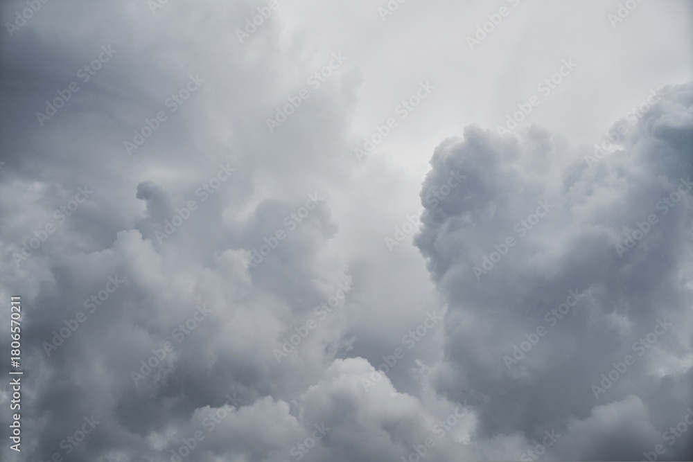 Obraz premium Dramatic stormy clouds rolling in, perfect for weather reports, atmospheric backgrounds, or conveying a sense of foreboding and change, powerful and evocative