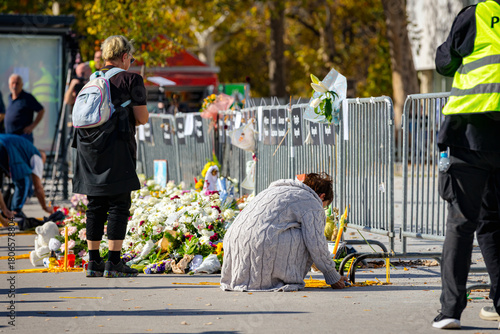 Candles and pile of flowers at the place where the accident happened