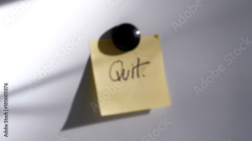 Blurred paper note on the whiteboard in the office. Abstract blur background of one sticky note. Concept of goodbye, board, quit, motivation, idea, interior for background, graphic, web.