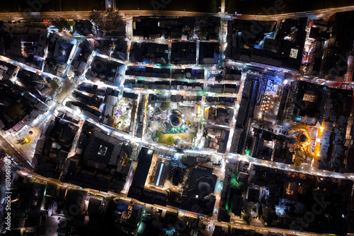 Aerial view of a vibrant city square illuminated at night, casting bright light on the surrounding buildings and streets, Sarajevo, Federation of Bosnia and Herzegovina, Bosnia and Herzegovina.
