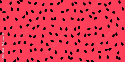 Close-up view of a vibrant red background with scattered black seeds, resembling watermelon flesh.