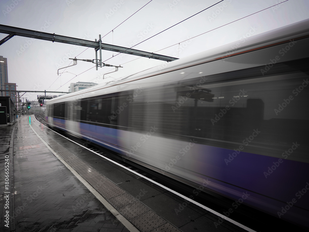 Fototapeta premium Train departing a UK station